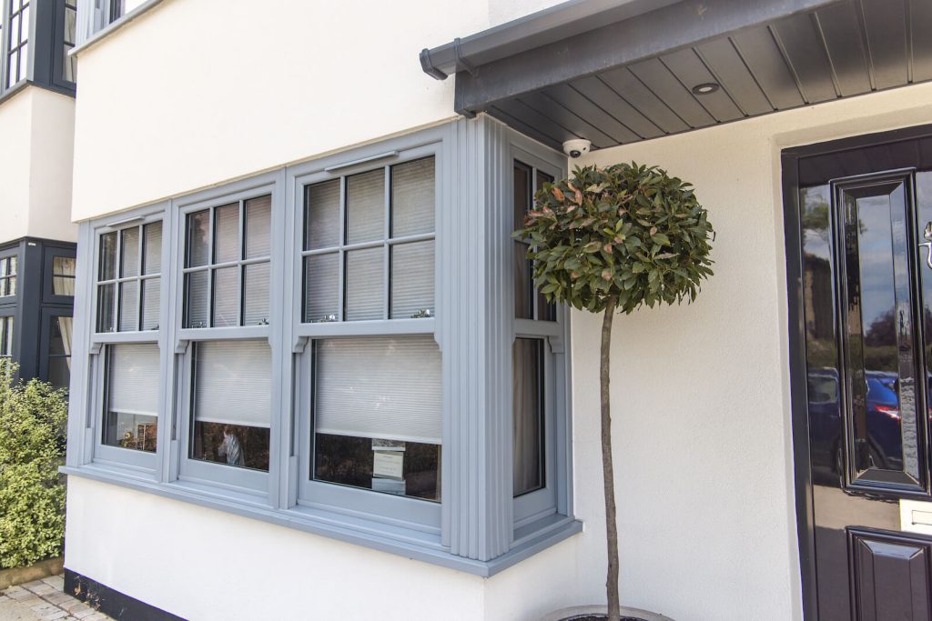 Grey sliding sash bay windows