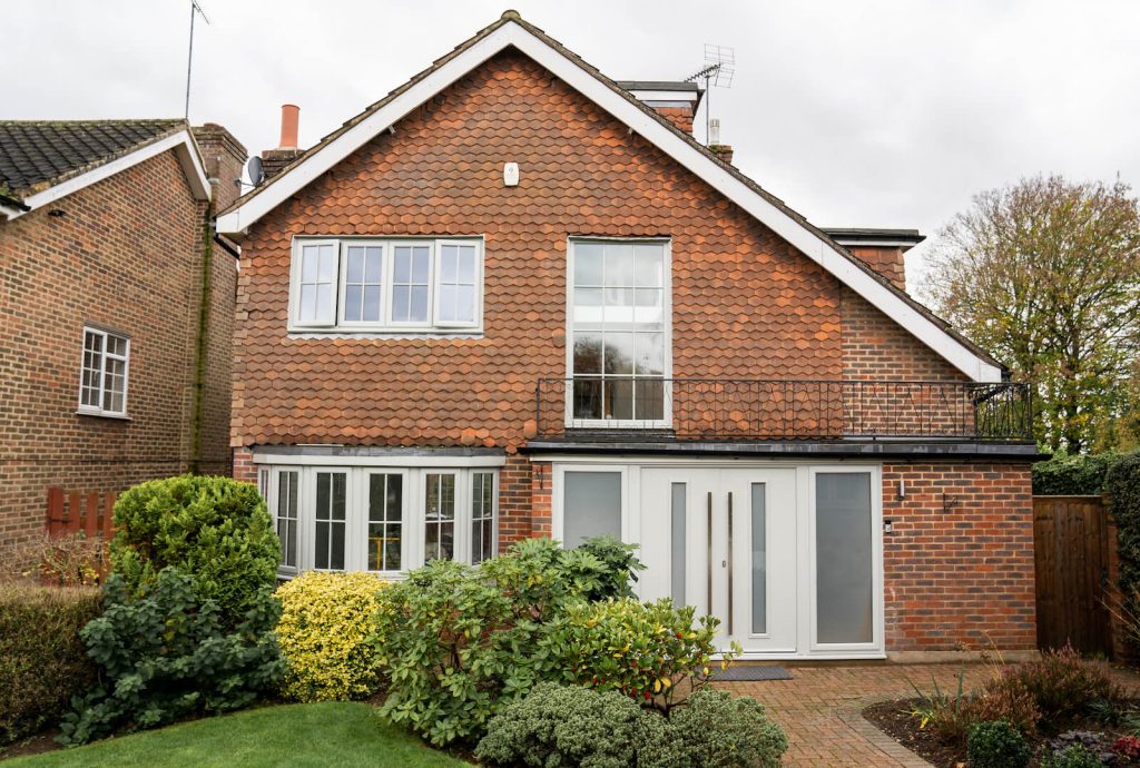 White window and door installation on residential house