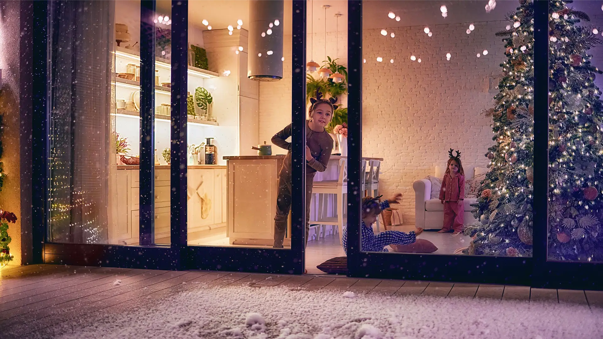 A festive photo of a small girl looking through a open door